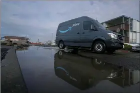  ?? JEFF CHIU — THE ASSOCIATED PRESS ?? An Amazon Prime truck drives in Pacifica, Calif., Tuesday.