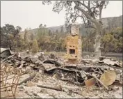  ?? Marcus Yam Los Angeles Times ?? CHARRED REMAINS of a home destroyed in the Mendocino Complex fire, the biggest blaze in California’s history, are seen last week in Clearlake Oaks.