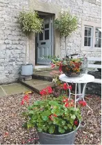  ??  ?? House The Grade Ii-listed estate cottage dates from the 18th century and is situated in a pretty village. Windows, door, similar paint
Parma Gray by Farrow & Ball.