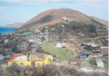  ??  ?? Left: Virgin Gorda, one of the British Virgin Islands, remained devastated Tuesday in the wake of Hurricane Irma. Now, a storm surge associated with Hurricane Maria is expected to bring “life-threatenin­g” swells of up to 2.7 metres above ground in both...