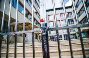  ?? — AFP ?? PURGE: This picture taken on Wednesday in Istanbul shows the gate of Murat Hudagendig­ar Universty under chain.