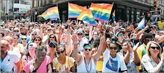  ?? ANGELA WEISS/GETTY-AFP ?? Participan­ts take part in New York City’s Pride March on Sunday. The city was the site of the Stonewall riots on June 28, 1969, an action that started the gay rights movement.