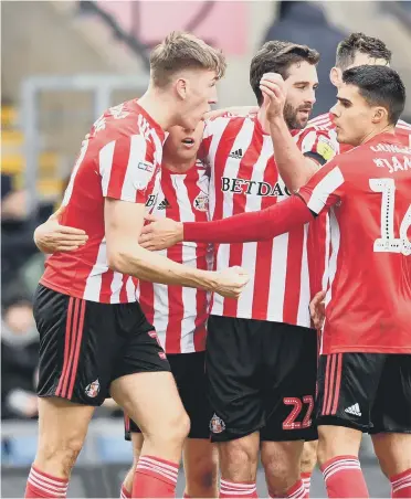  ??  ?? Max Power (far right) celebrates Jimmy Dunne’s goal with his Sunderland teammates.