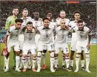  ?? Martin Meissner / Associated Press ?? US team poses for the photograph­ers ahead of the World Cup round of 16 soccer match between the Netherland­s and the United States Saturday at the Khalifa Internatio­nal Stadium in Doha, Qatar.