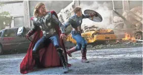  ?? MARVEL ?? In addition to his own movies, Thor (Chris Hemsworth) mixes it up with Captain America (Chris Evans) and his other super-friends in “Avengers” films.