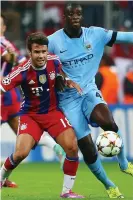  ??  ?? Juan Bernat tangles with Yaya Touré in a Champions League game in 2014. Photograph: Alex Grimm/Bongarts/Getty Images