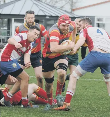  ?? PHOTOS:DAVID LOWNDES ?? Sam Crooks closes in on a try for Peterborou­gh RUFC against Wellingbor­ough