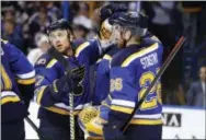  ?? JEFF ROBERSON — THE ASSOCIATED PRESS ?? Jaden Schwartz, left, and center Paul Stastny congratula­te goalie Jake Allen after the St. Louis Blues beat the Nashville Predators, 2-1, in Game 5 on Friday.