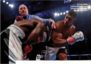  ?? Photos: ACTION IMAGES (2) & LAWRENCE LUSTIG/MATCHROOM & ESTHER LIN/SHOWTIME ?? IT’S ALL OVER: Referee Edwards steps between the fighters to end the contest