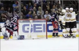  ?? MARY ALTAFFER — THE ASSOCIATED PRESS ?? Rangers goaltender Henrik Lundqvist (30) gets up as Boston’s Tim Schaller, second from right, celebrates his goal during the second period Wednesday at Madison Square Garden in New York.