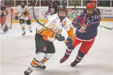  ?? DAX MELMER ?? Essex's Conor Dembinski and Petrolia's Peyton Armitage battle in the PJHL hockey playoffs at the Essex Centre on Sunday.