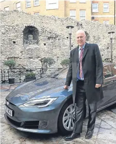  ?? Picture: PA. ?? Chris Grayling arrived at the event in London in a semiautono­mous Tesla vehicle.