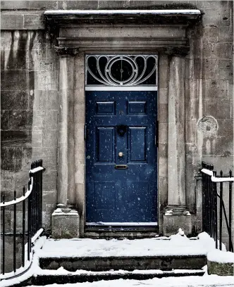  ?? ?? Outside no 9: Finding a dark door helped to bring out the falling snow in this image.