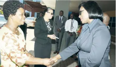  ??  ?? First Lady Esther Lungu being welcomed by Zambia Associatio­n of Manufactur­ers president Roseta Chabala during the Zambia Manufactur­ers giving back! charity event at UTH Cancer Disease Hospital yesterday -Picture by THOMAS NSAMA