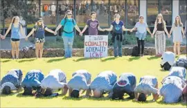  ?? K.C. Alfred San Diego Union-Tribune ?? SAN DIEGO Unified’s anti-Islamophob­ia plan involves more learning opportunit­ies for students. Above, a show of support for Muslim students at UC San Diego.