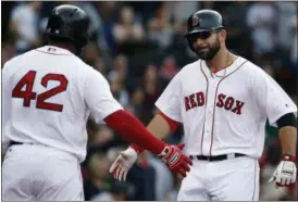  ?? MICHAEL DWYER — THE ASSOCIATED PRESS ?? Boston Red Sox’s Mitch Moreland, right, celebrates his home run with teammate Pablo Sandoval during the second inning of a baseball game against the Tampa Bay Rays in Boston, Saturday in Boston.