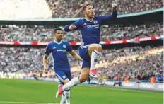  ?? Reuters ?? Chelsea’s Eden Hazard celebrates scoring their third goal with Diego Costa against Tottenham on Saturday.