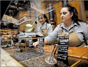  ?? AP/LUCA BRUNO ?? Employees at a Starbucks roastery in Milan, Italy, prepare Thursday for today’s opening day.