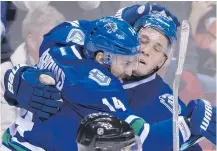  ?? — THE CANADIAN PRESS FILES ?? Vancouver Canucks’ Bo Horvat, right, celebrates a short-handed goal with linemate Alex Burrows during Saturday’s game.