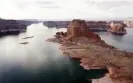  ?? Photograph: Rick Wilking /Reuters ?? Dry land that would be underwater when the lake is full is seen next to Gregory Butte in Arizona’s Lake Powell.