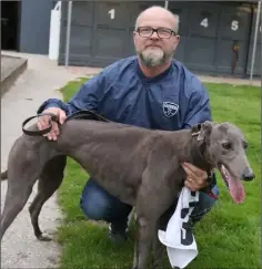  ??  ?? Andrew Sinnott with another winning greyhound, Bay City Bella.