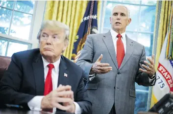  ?? MANDEL NGAN/GETTY IMAGES ?? U.S. Vice-president Mike Pence, right, has denied writing a contentiou­s op-ed in The New York Times that labelled President Donald Trump as incompeten­t and impetuous.