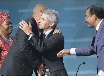  ?? Carolyn Kaster Associated Press ?? A 2012 AIDS CONFERENCE brought together, from left, professor and health advocate Sheila Tlou, activist Phill Wilson, infectious disease expert Dr. Anthony Fauci and then-UNAIDS Executive Director Michel Sidibe.