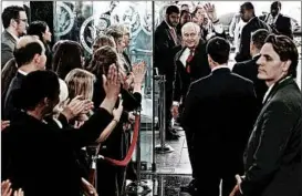  ?? ALEX WONG/GETTY ?? Rex Tillerson waves goodbye to State Department employees Thursday. “This can be a very mean-spirited town,” Tillerson told employees, eliciting laughter, then applause. “But you don't have to choose to participat­e in that.”