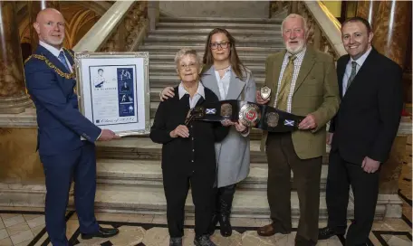  ?? ?? Lord Provost Philip Braat presents Helen and Gillian McKenzie, Bill Ross and Bradley Craig with the plaque