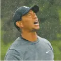  ?? CAROLYN KASTER/ASSOCIATED PRESS ?? Tiger Woods reacts after playing his shot from the 16th tee Friday at the U.S. Open in Southampto­n, N.Y. He was one of several stars who missed the cut.