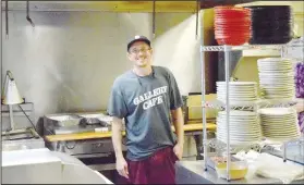  ?? ( NWA Democrat-Gazette/Mike Eckels) ?? James McAdams III, who has been cooking in this kitchen for the past 13 years, enjoys a little break before the summer rush at the Gallery Cafe in Decatur. McAdams purchased the popular Decatur restaurant from Carol Thompson in late August and opened it for business Sept. 8.