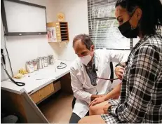  ??  ?? Dr. Jose Correa conducts a checkup of Stambaugh at the Albergue Olímpico Germán Rieckehoff athletic training center in Salinas, Puerto Rico.