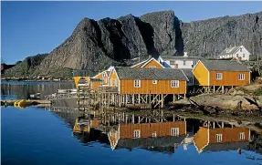  ??  ?? The houses of Moskenesoy­a on Sakrisoya Island add a stirring human element on the landscape.