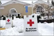  ?? ELIAS FUNEZ — THE UNION VIA AP ?? An American Red Cross warming center has been establishe­d in Madelyn Helling Library in Nevada City, Calif., Tuesday, Dec. 28, 2021. Snow, ice and unseasonab­le cold in the Pacific Northwest and the Sierra Nevada are continuing to disrupt traffic, cause closures and force people to find refuge in emergency warming shelters.