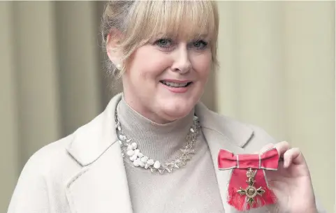  ?? Yui Mok ?? > Actress Sarah Lancashire after she was awarded an OBE by the Duke of Cambridge at Buckingham Palace yesterday