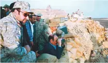  ?? Courtesy: 26 September Net. ?? Yemeni Vice-President Ali Mohsen (centre) observes the progress of military action against Al Houthis in the frontlines of Saada.