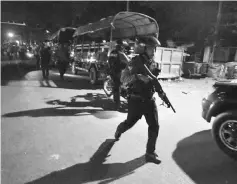  ??  ?? File photo shows Myanmar riot police patrolling along a street in Yangon’s Mingalar Taung Nyunt township after scuffles broke out between Buddhist nationalis­ts and Muslims. — AFP photo