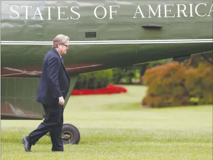  ?? AP PHOTO ?? Steve Bannon, chief White House strategist to President Donald Trump, walks from Marine One on the South Lawn of the White House in Washington. Bannon is leaving his White House post.