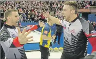  ?? SUBMITTED ?? P.E.I.’s Brett Gallant, right, and team skip Brad Gushue celebrate at the world curling championsh­ip against Sweden.