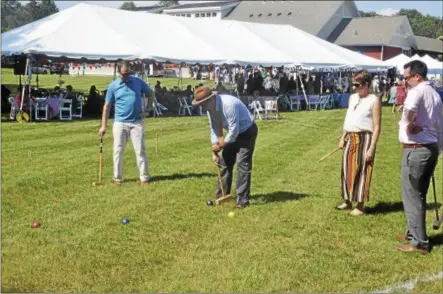  ?? PHOTOS BY JOSEPH PHELAN — JPHELAN@DIGITALFIR­STMEDIA.COM ?? AIM Services Inc. held its fourth annual Croquet on the Green tournament and garden party.