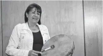  ?? CAPE BRETON POST ?? Karen Bernard, director of the Jane Paul Indigenous Women's Centre in Cape Breton, holds a drum at a recent grandmothe­r's gathering she organized.