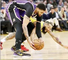  ??  ?? File photo shows Anthony davis (left) of the los Angeles lakers and Ky Bowman of the Golden State Warriors going for a loose ball at Chase Center in San Francisco, California. — AFP photo