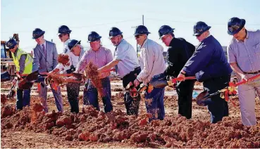  ?? [PHOTO BY JOSH WALLACE, THE OKLAHOMAN] ?? Del City officials and representa­tives from CMSWillowb­rook and Kirkpatric­k Architect Studio shovel dirt at the site of the new fire station.