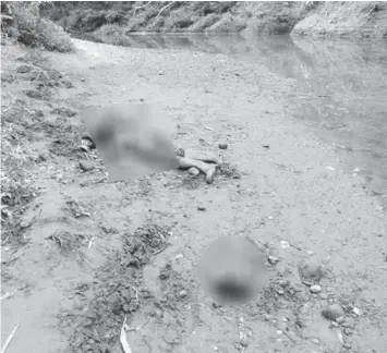  ??  ?? Photo shows the area beside the Hibatang River at Barangay Palanogan in Calbayog City, Samar where the beheaded body of Reynaldo Dealagdon, a suspected member of a private armed group, was found.