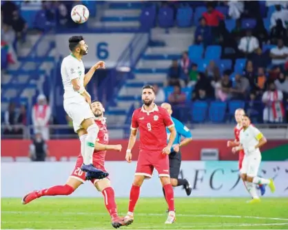  ??  ?? Saudi Arabia’s Mohammed Al Fatil heads the ball during their Asian Cup Group E match against Lebanon at the Maktoum Bin Rashid Al Maktoum Stadium in Dubai.