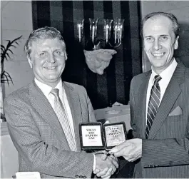  ??  ?? Ashton, ‘The Voice of the People’, presented with his Columnist of the Year award by Norman Tebbit