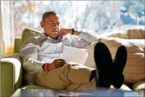  ?? OFFICIAL WHITE HOUSE PHOTO BY PETE SOUZA ?? President Barack Obama reads briefing material while meeting with advisors inside his cabin at Camp David, Sunday, Oct. 21, 2012.