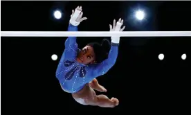  ?? Photograph: Naomi Baker/Getty Images ?? Simone Biles puts in a solid performanc­e on the uneven bars which in the past has been her weakest discipline.