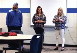  ?? ALEX FARRER / staff ?? New Gordon Central coach Sara Broom (right) introduces her assistants Austin Norrell (left) and Maci Mills at a meet and greet on Wednesday.