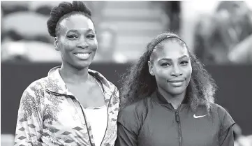  ??  ?? Serena Williams of the US (R) and Venus Williams of the US before the women’s singles final on day 13 of the Australian Open tennis tournament in Melbourne. - AFP photo